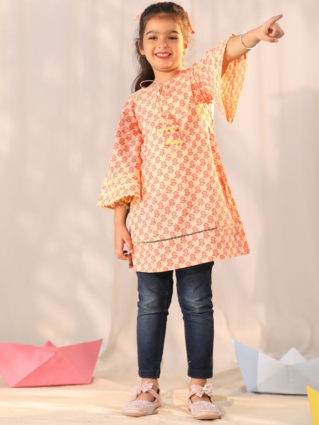 

VASTRAMAY Girls Floral Printed Tie-Up Neck Flared Sleeves Cotton Kurta, Peach
