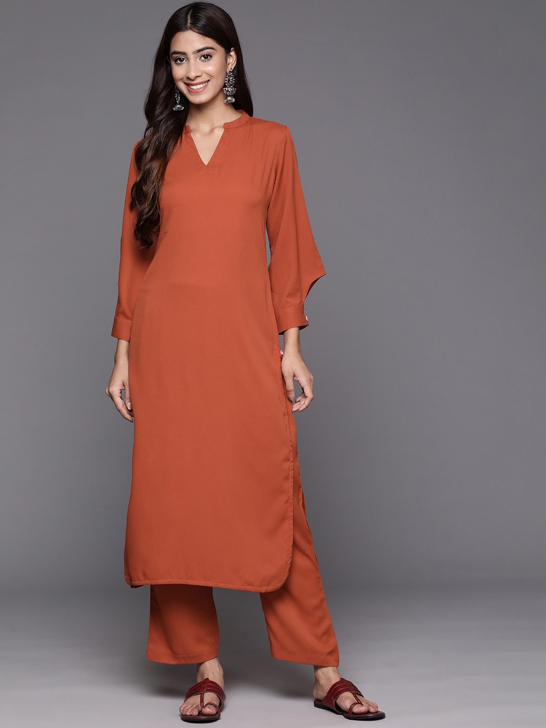 

Varanga Textured Mandarin Collar Long Sleeves Straight Kurta With Trouser, Rust