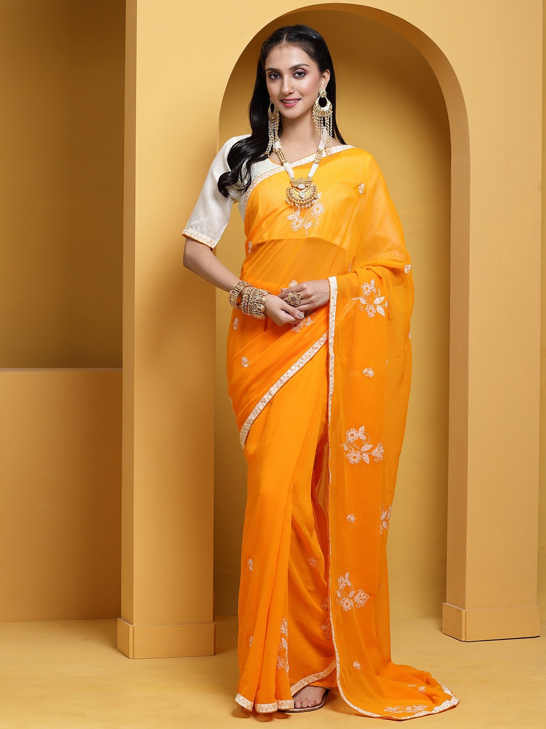 

Mitera Ethnic Motifs Embroidered Sequinned Pure Georgette Saree, Yellow