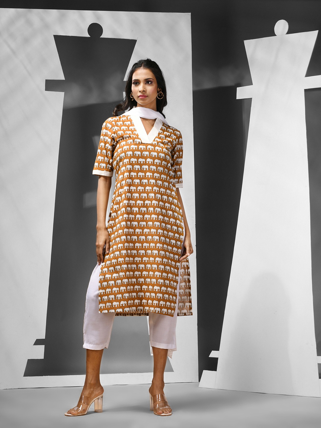 

Charukriti Women Printed Regular Pure Cotton Kurta with Trousers & With Dupatta, Mustard