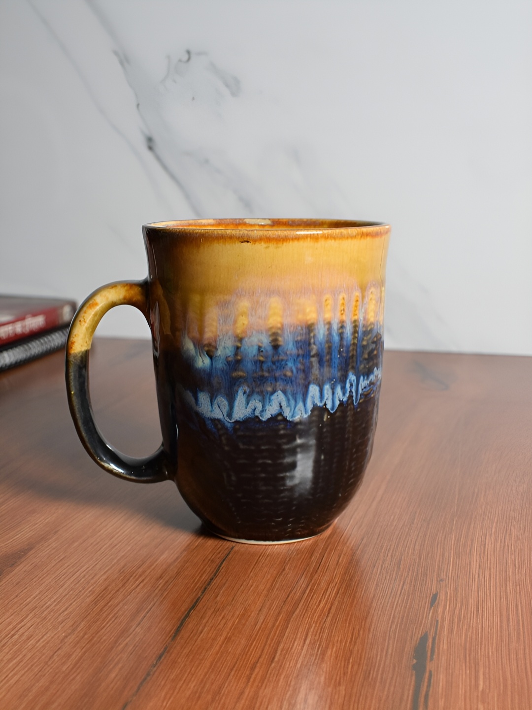 

The Decor Lane Yellow & Blue Textured Ceramic Glossy Mug