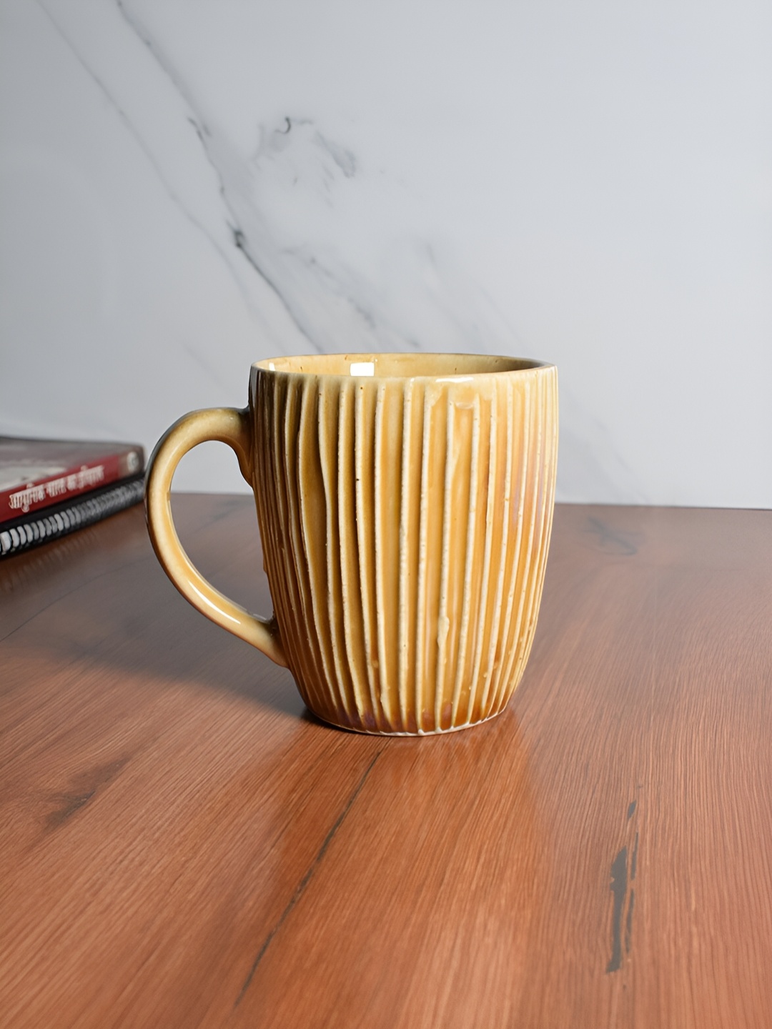 

The Decor Lane Mustard Textured Ceramic Glossy Mug
