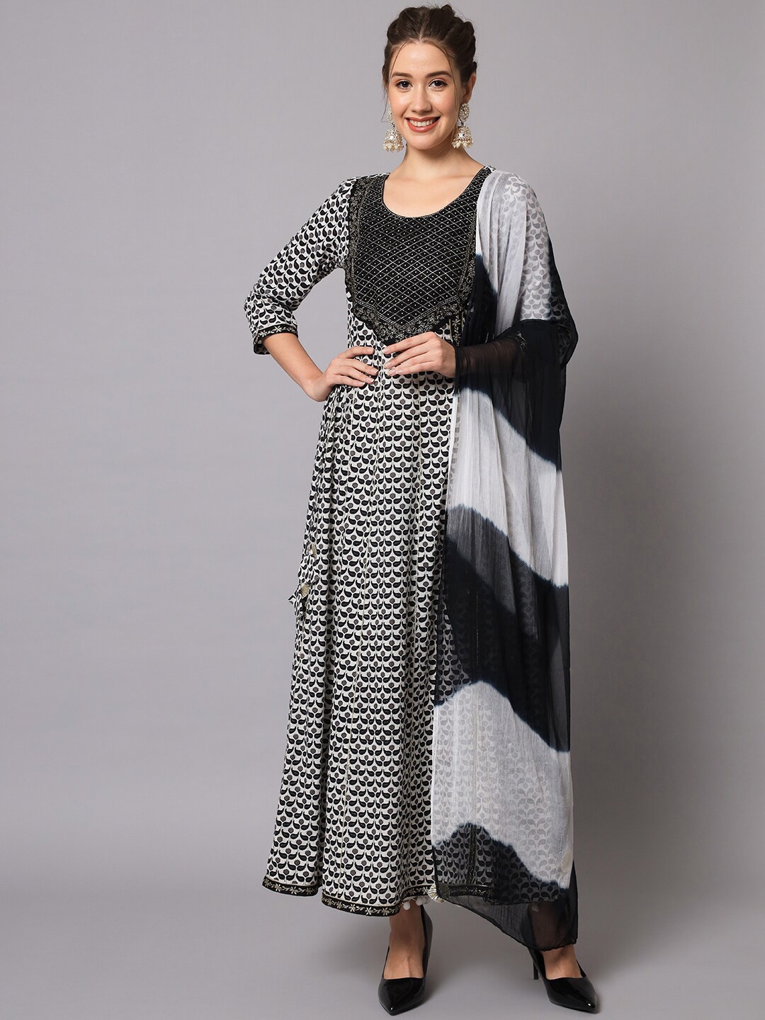 

Meeranshi Women Ethnic Motifs Printed Regular Thread Work Kurta with Palazzos & With Dupatta, Black