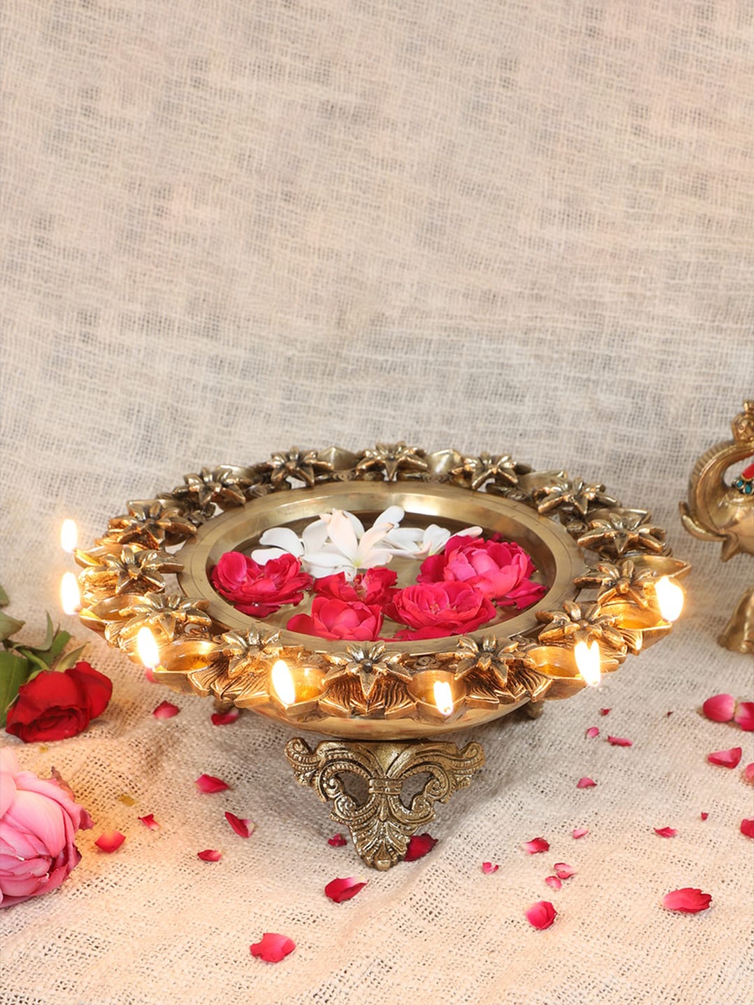 

Two Moustaches Gold toned Lotus Flower Design Brass Decorative Bowl with 14 Diyas