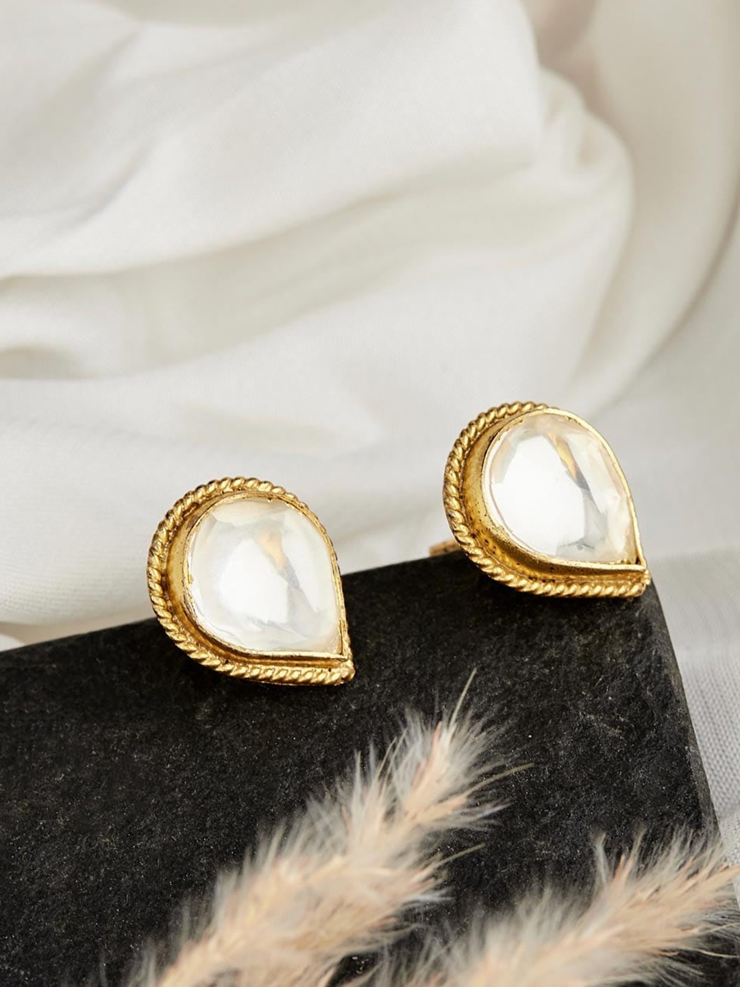 

Fabindia Silver Artificial Stones Studded Teardrop Shaped Studs Earrings, Gold