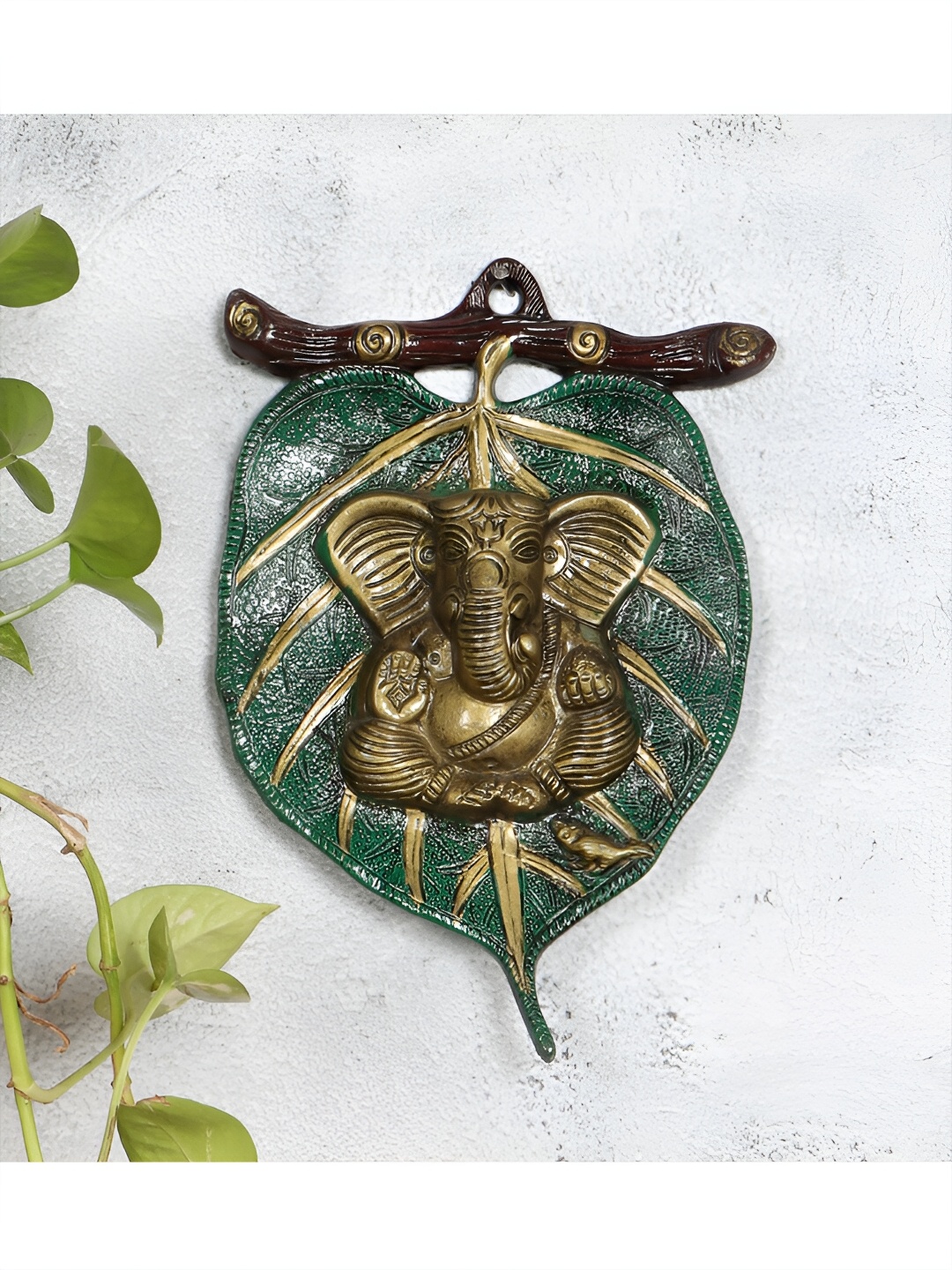 

Two Moustaches Green & Brown Ganesha On Patta Metal Wall Hanging