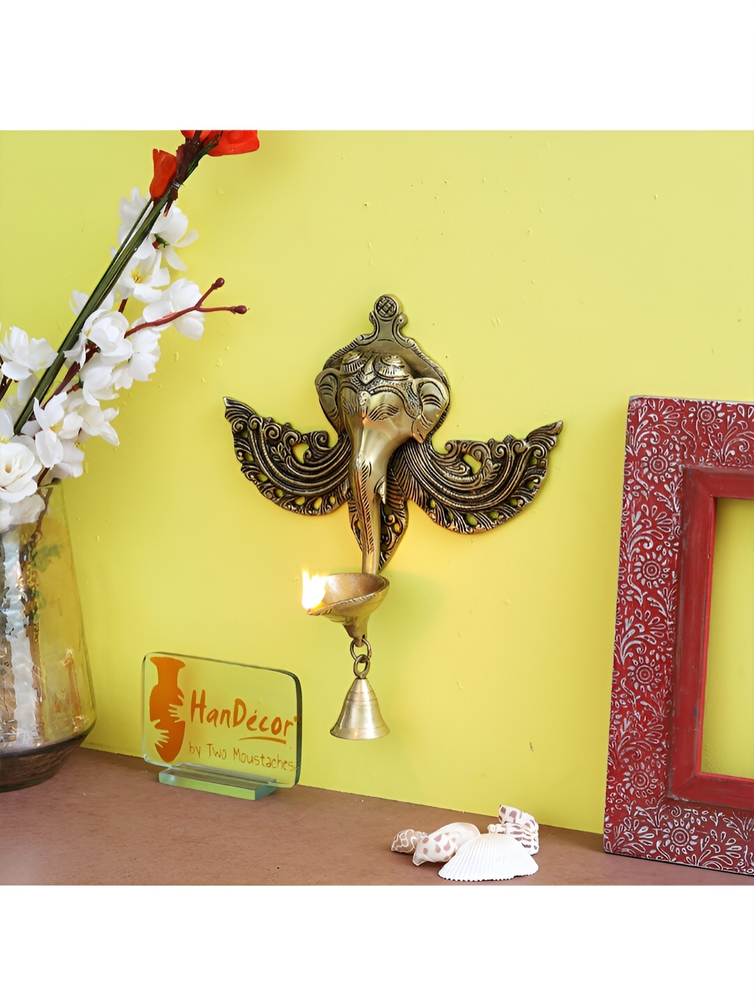

Two Moustaches Gold Toned Ganesha Brass Wall Hanging Diya