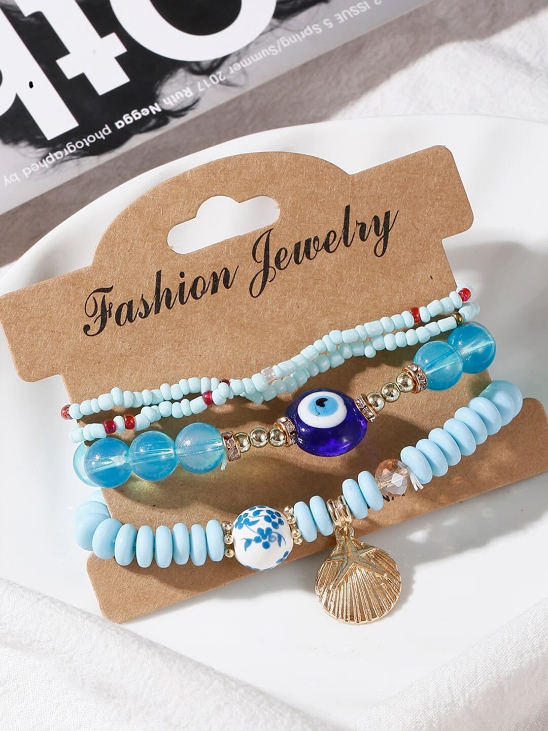 

YouBella Unisex Set of 4 Beaded Lucky Evil Eye Elasticated Bracelets, Gold