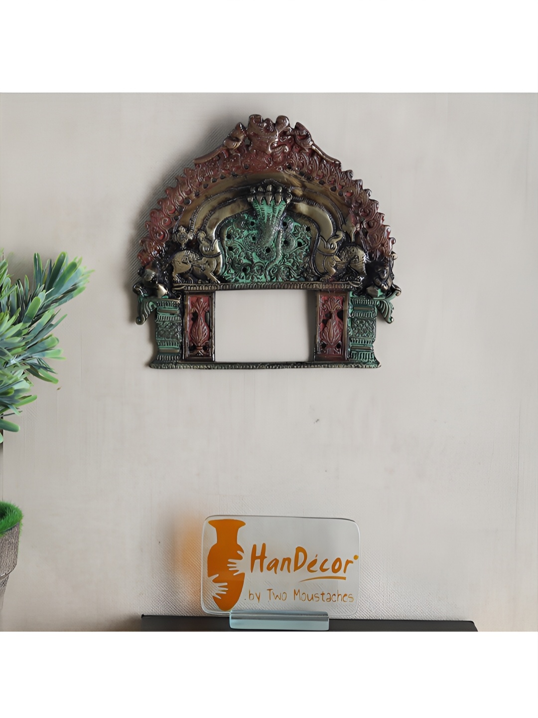 

Two Moustaches Metallic Toned Green Brass Prabhavali Wall Hanging