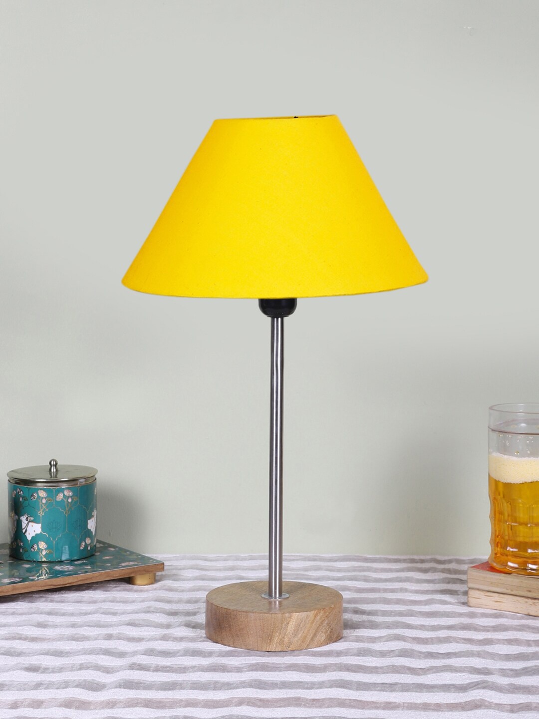 

Devansh Yellow Textured Wooden Contemporary Frustum Shaped Table Lamp