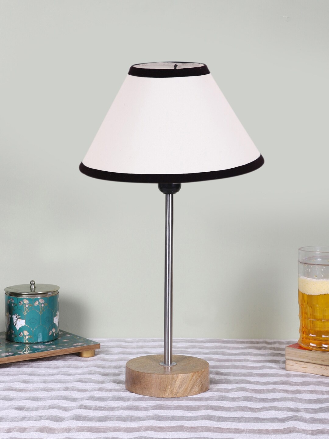 

Devansh White Textured Wooden Contemporary Frustum Shaped Table Lamp