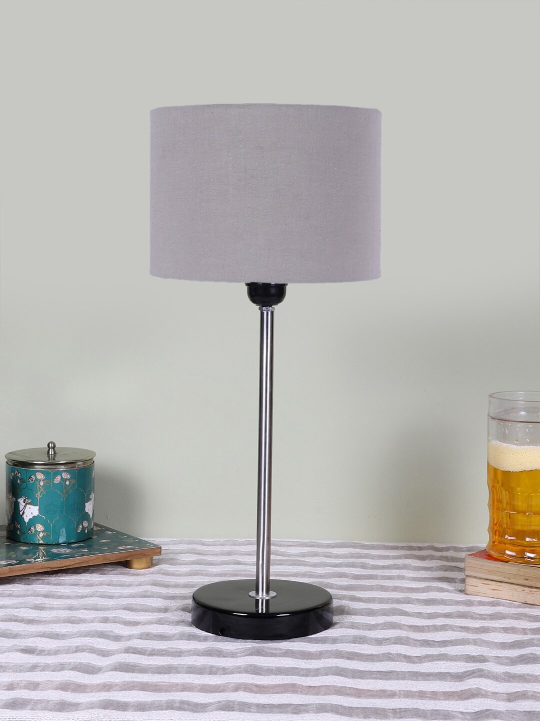 

Devansh Grey Textured Wooden Contemporary Cylindrical Shaped Table Lamp