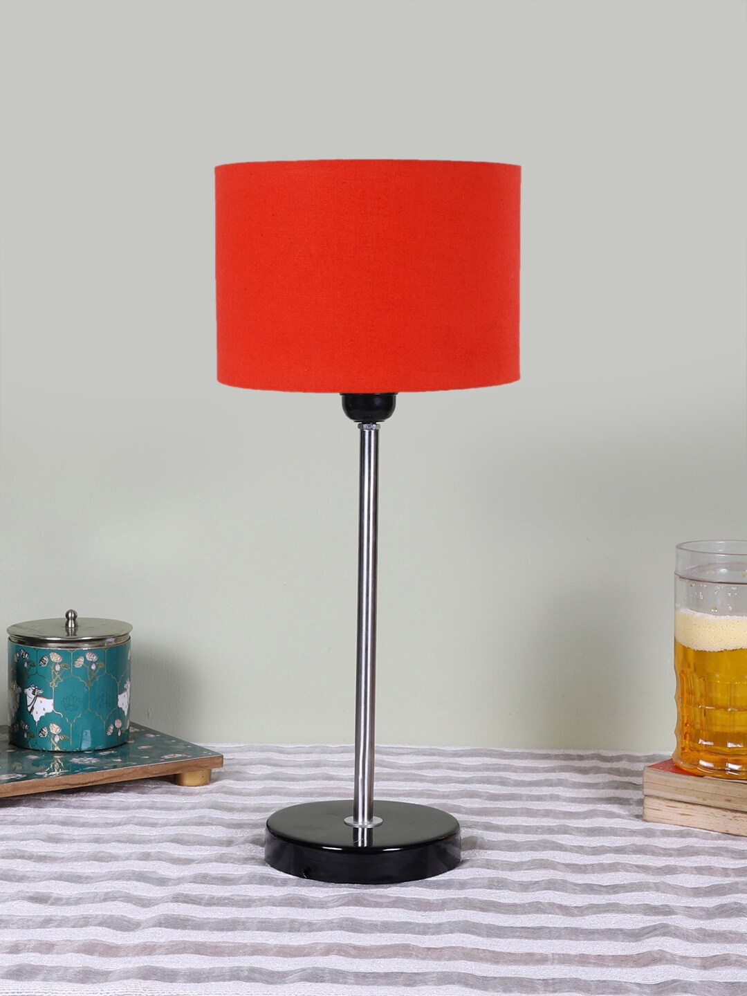 

Devansh Orange Cotton Shade Cylinderical Table Lamps