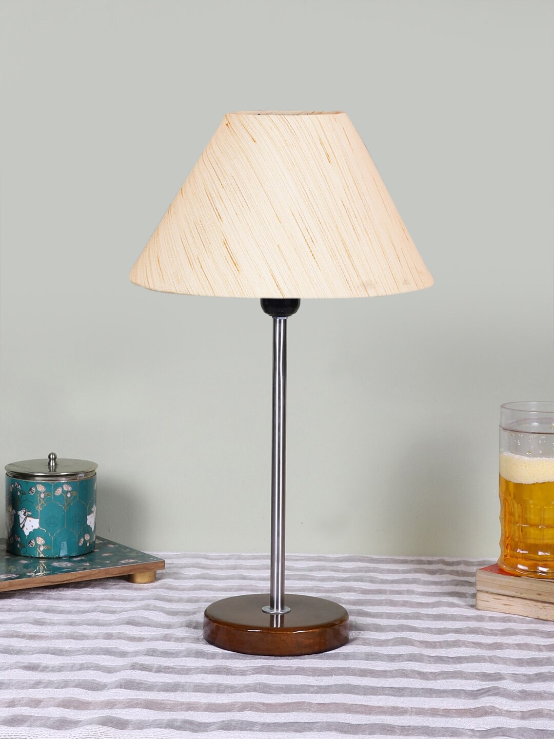 

Devansh Unisex Off White Textured Cotton Shade Frustum Shape Table Lamp
