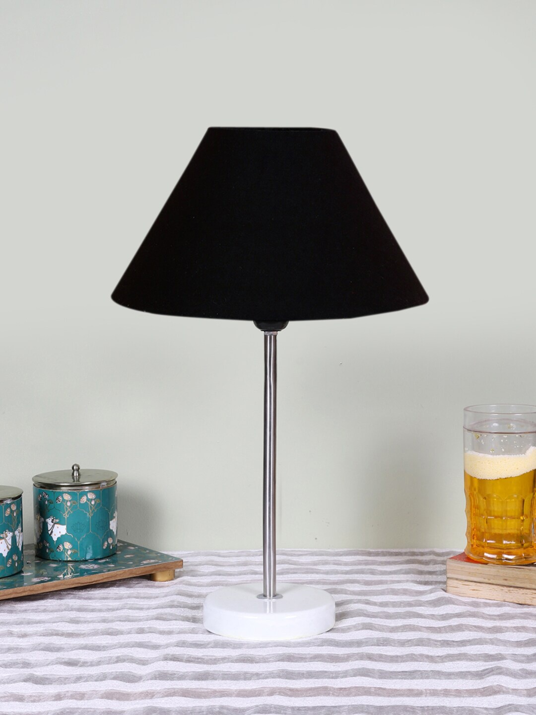 

Devansh Black Textured Wooden Contemporary Frustum Shaped Table Lamp