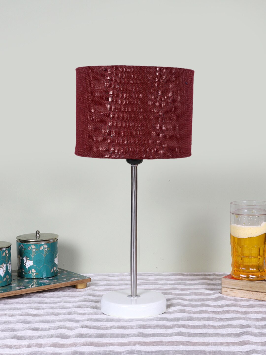 

Devansh Maroon Textured Wooden Contemporary Cylindrical Shaped Table Lamp