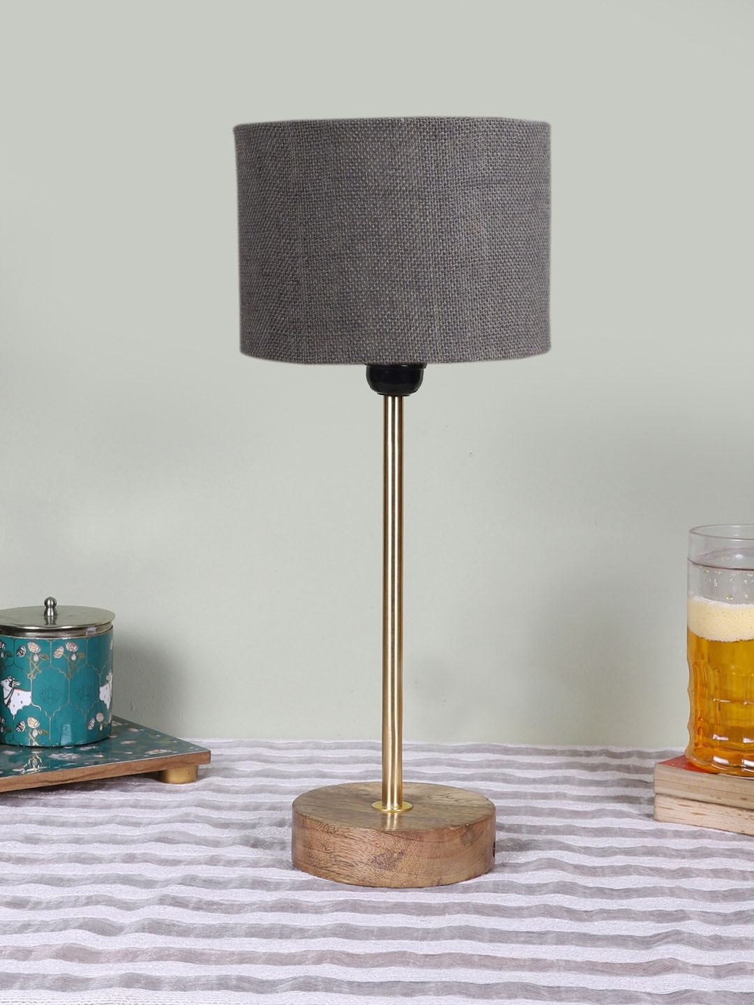 

Devansh Grey Textured Wooden Contemporary Cylindrical Shaped Table Lamp