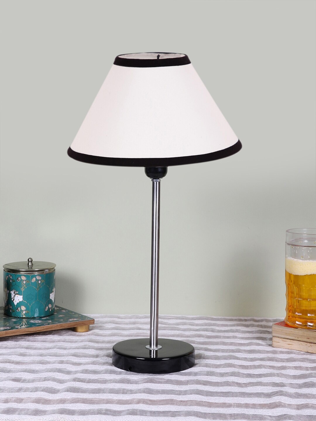 

Devansh White Wooden & Cotton Frustum Contemporary Table Lamp
