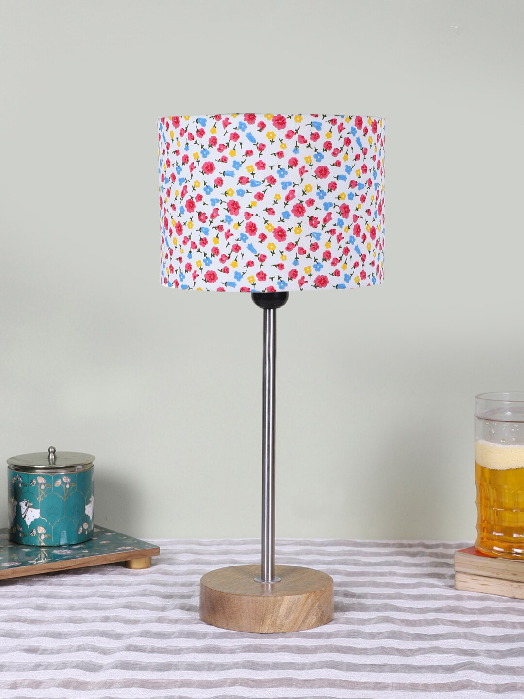 

Devansh White Printed Wood & Cotton Cylinder Contemporary Table Lamp