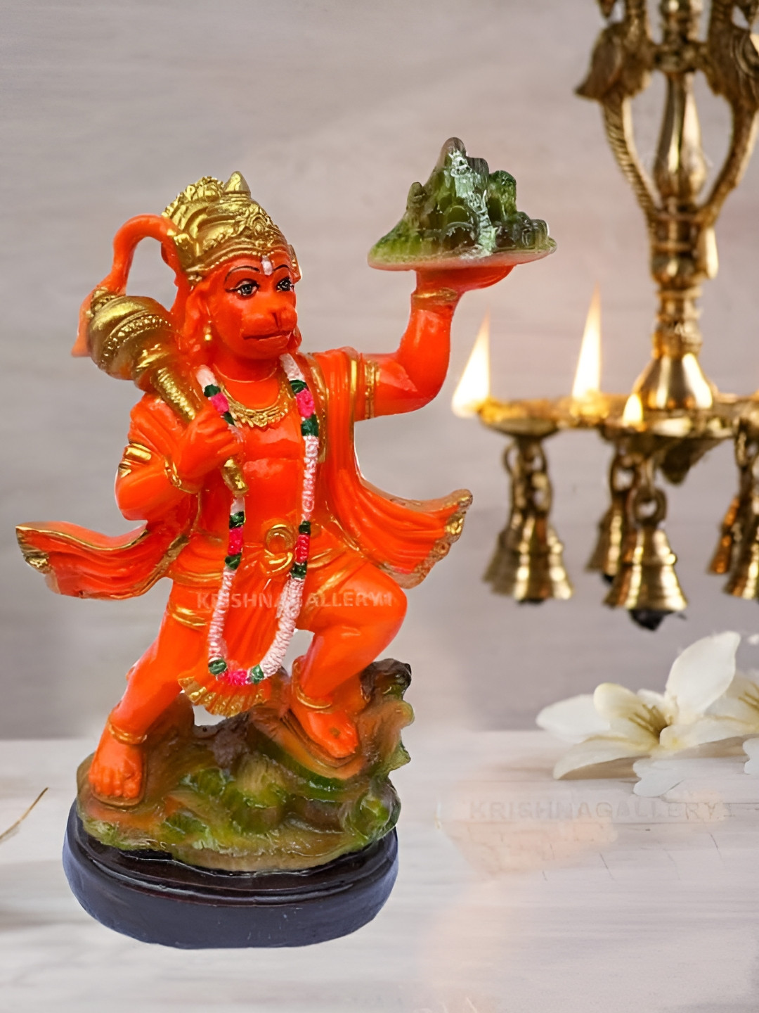 

krishnagallery1 Orange Coloured Hanuman Ji Murti Showpiece