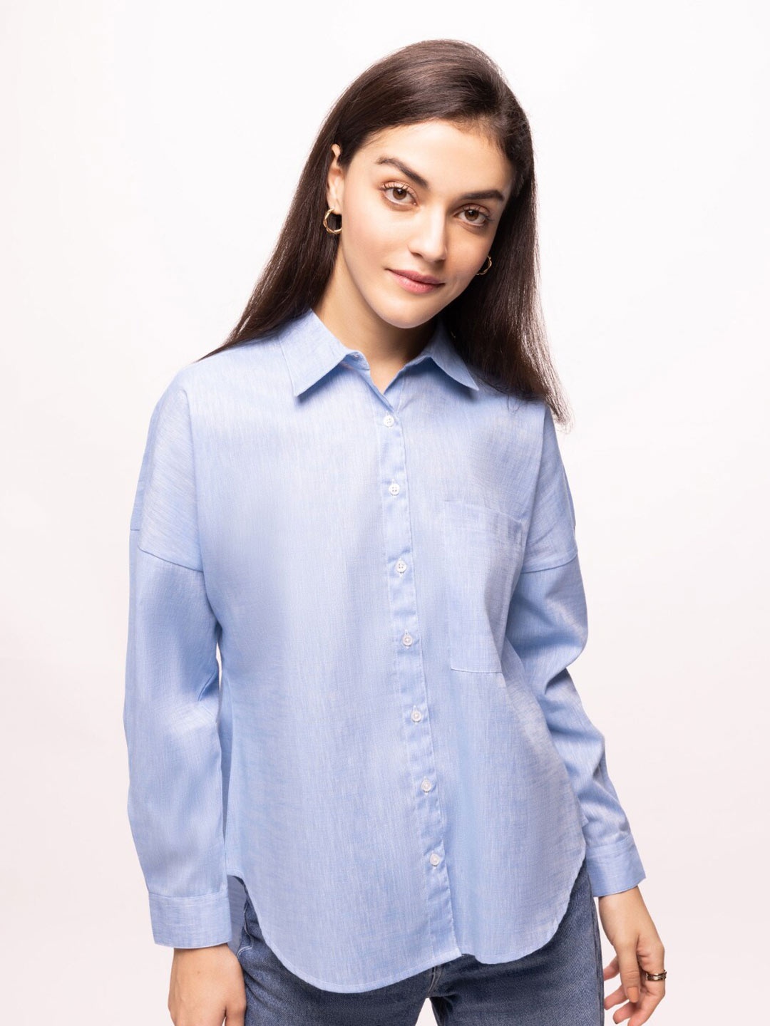 

Bombay High Women Oversized Solid High Low Hem Textured Shirt, Blue