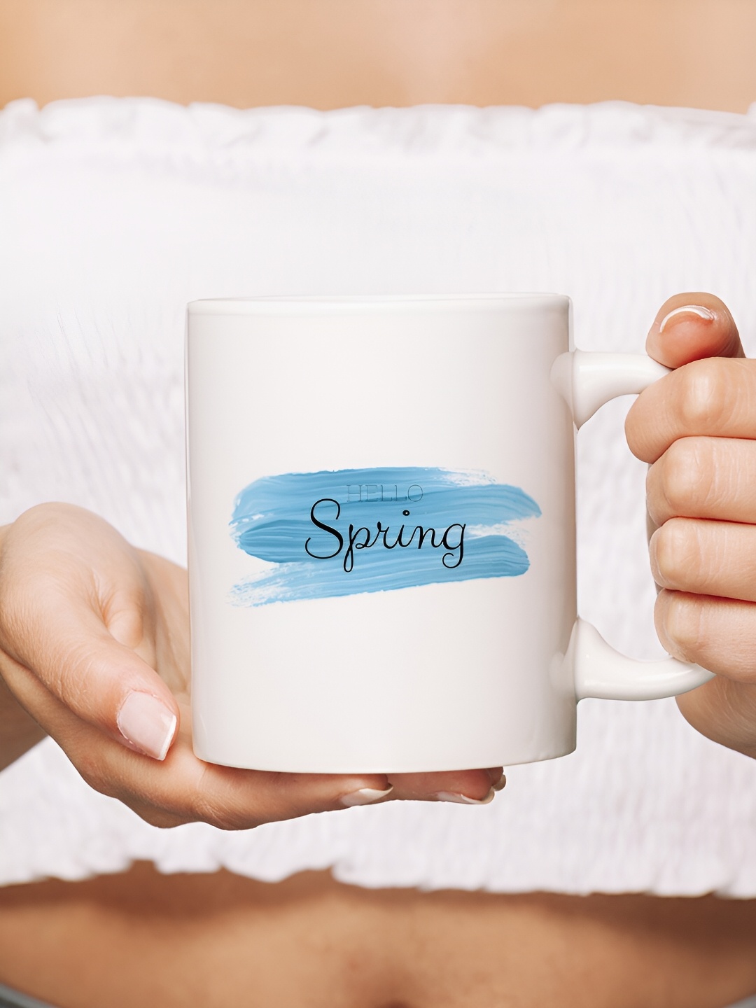 

The Decor Lane White & Blue Printed Ceramic Glossy Mug 325 ml