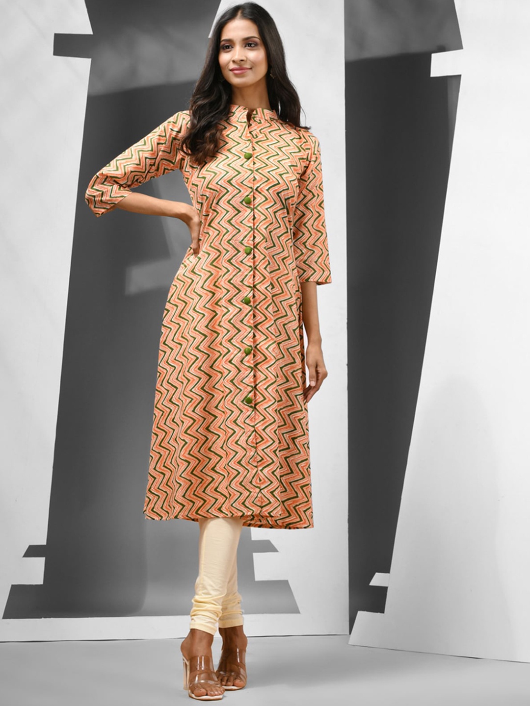 

Charukriti Geometric Printed Round Neck Cotton A-Line Kurta, Orange