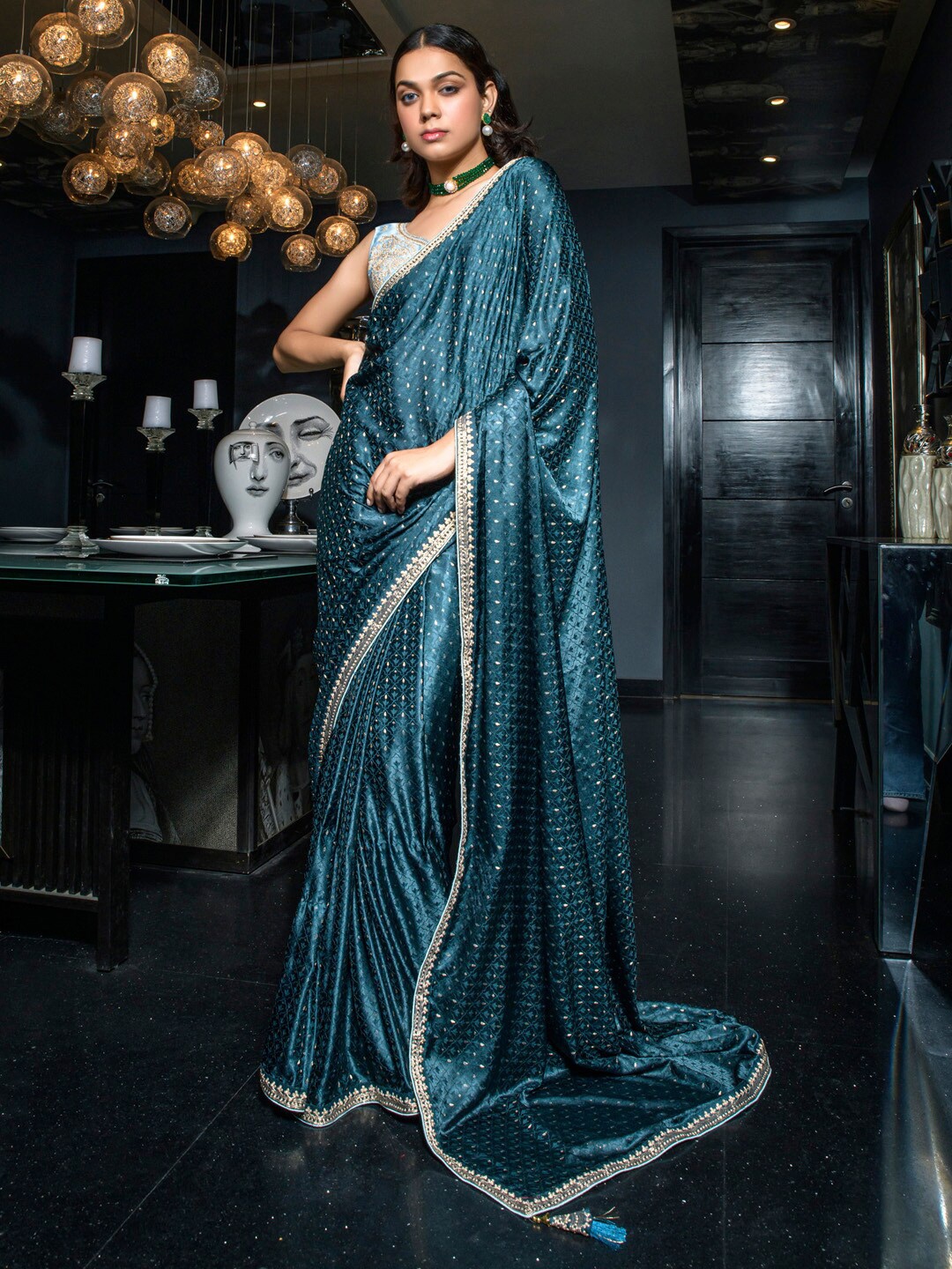 

Mitera Teal Blue & Silver toned Embellished Embroidered Satin Saree
