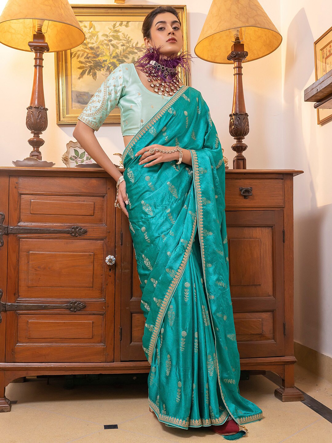 

Mitera Blue & Gold toned Ethnic Motifs Sequinned Saree