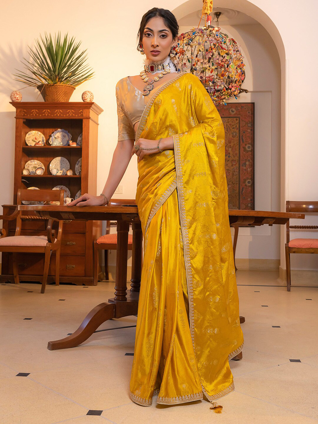 

Mitera Yellow & Gold toned Ethnic Motifs Embellished Sequinned Saree