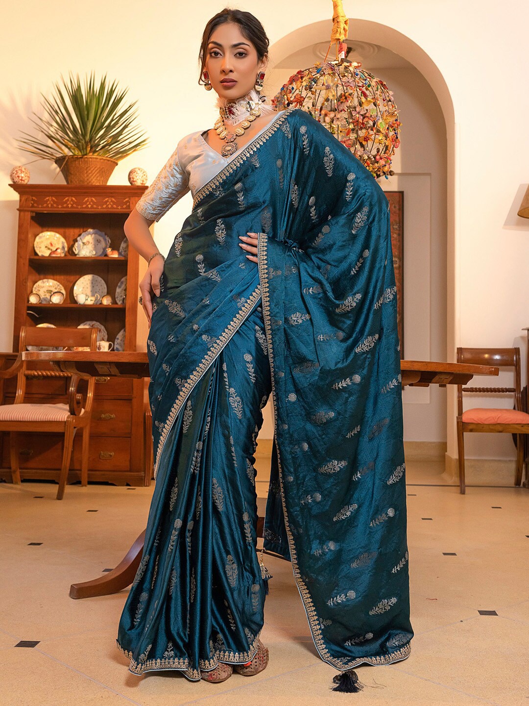 

Mitera Teal Blue & Gold toned Ethnic Motifs Sequinned Saree