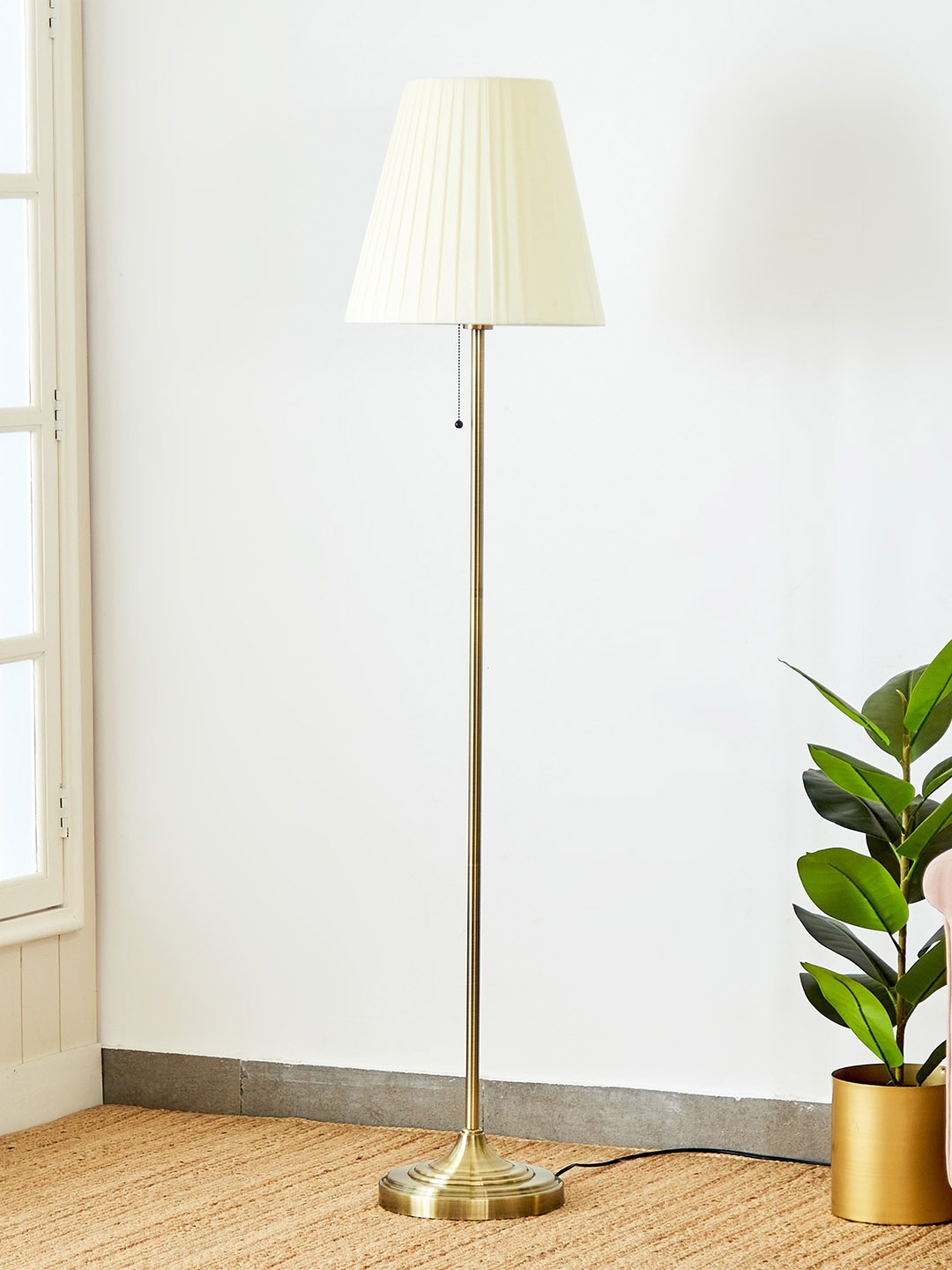 

Home Centre Melody Shellacs Yellow Frustum Metal Floor Lamp