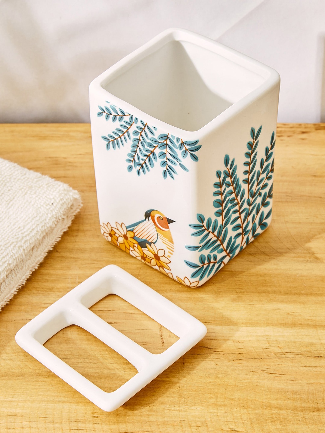 

Home Centre White Ethnic Motifs Ceramic Toothbrush Holder