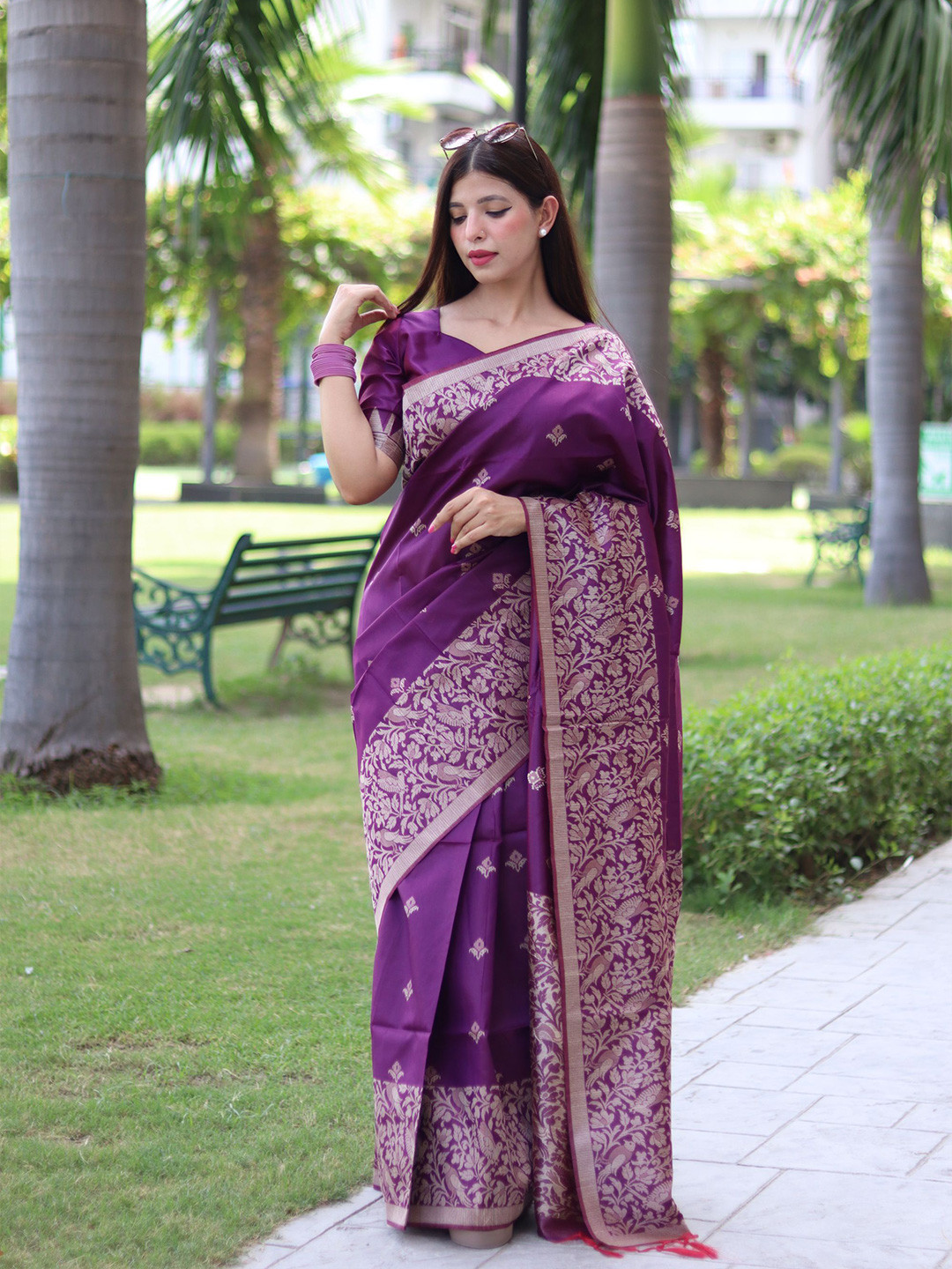 

Mitera Purple Ethnic Motifs Woven Design Zari Saree