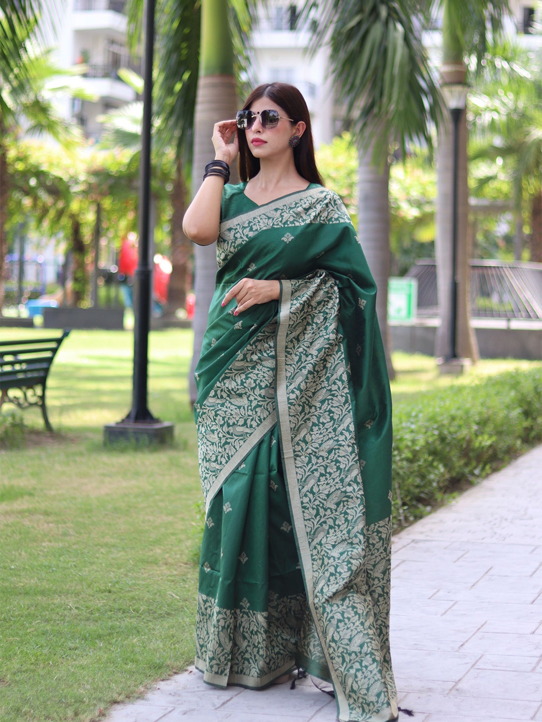 

Mitera Green Ethnic Motifs Woven Design Zari Saree