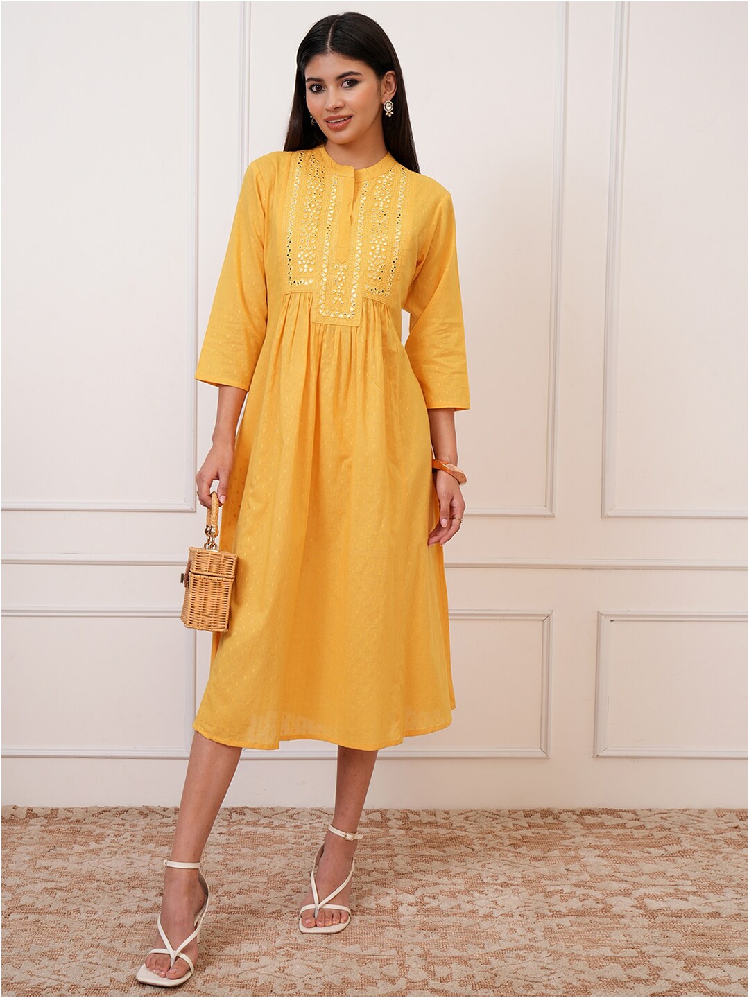 

Vishudh Yellow Ethnic Motifs Embroidered A-Line Midi Ethnic Dress