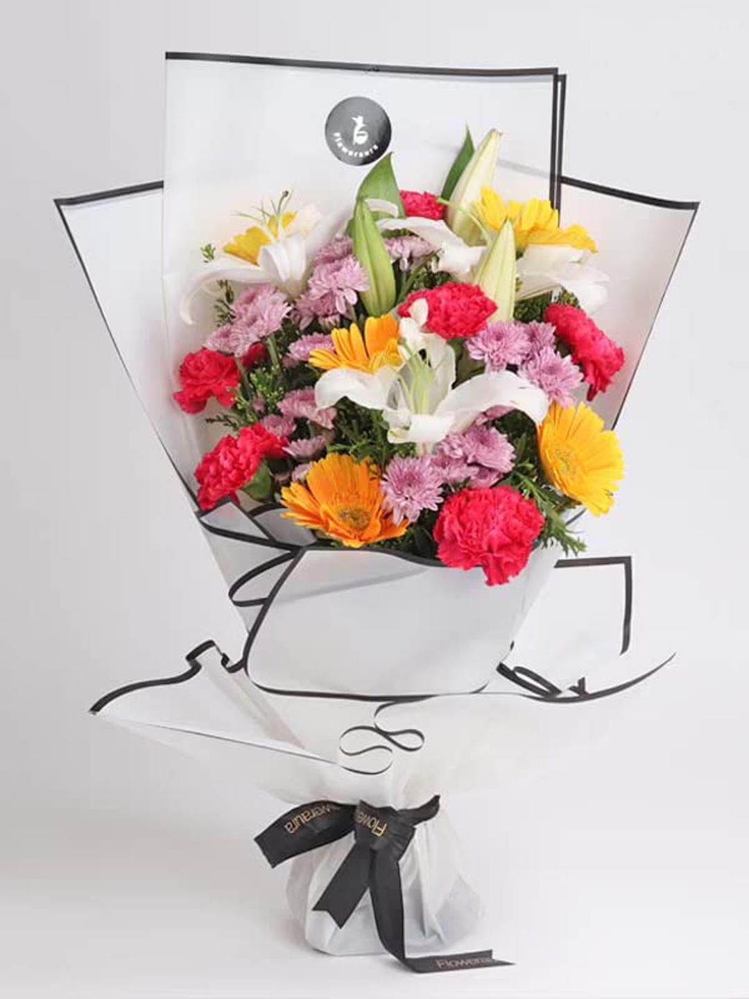 

Floweraura 3 White Lily & 3 Pink Daisy & 12 Red Carnation & Yellow Gerberas Flower Bouquet