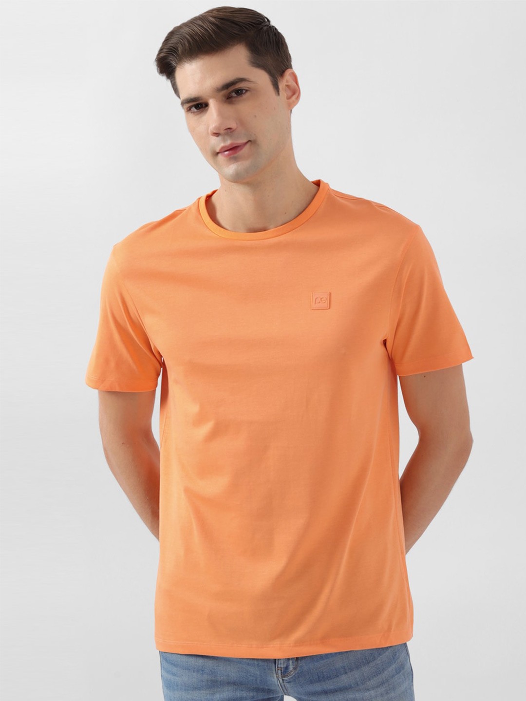

Peter England Men Raw Edge T-shirt, Orange