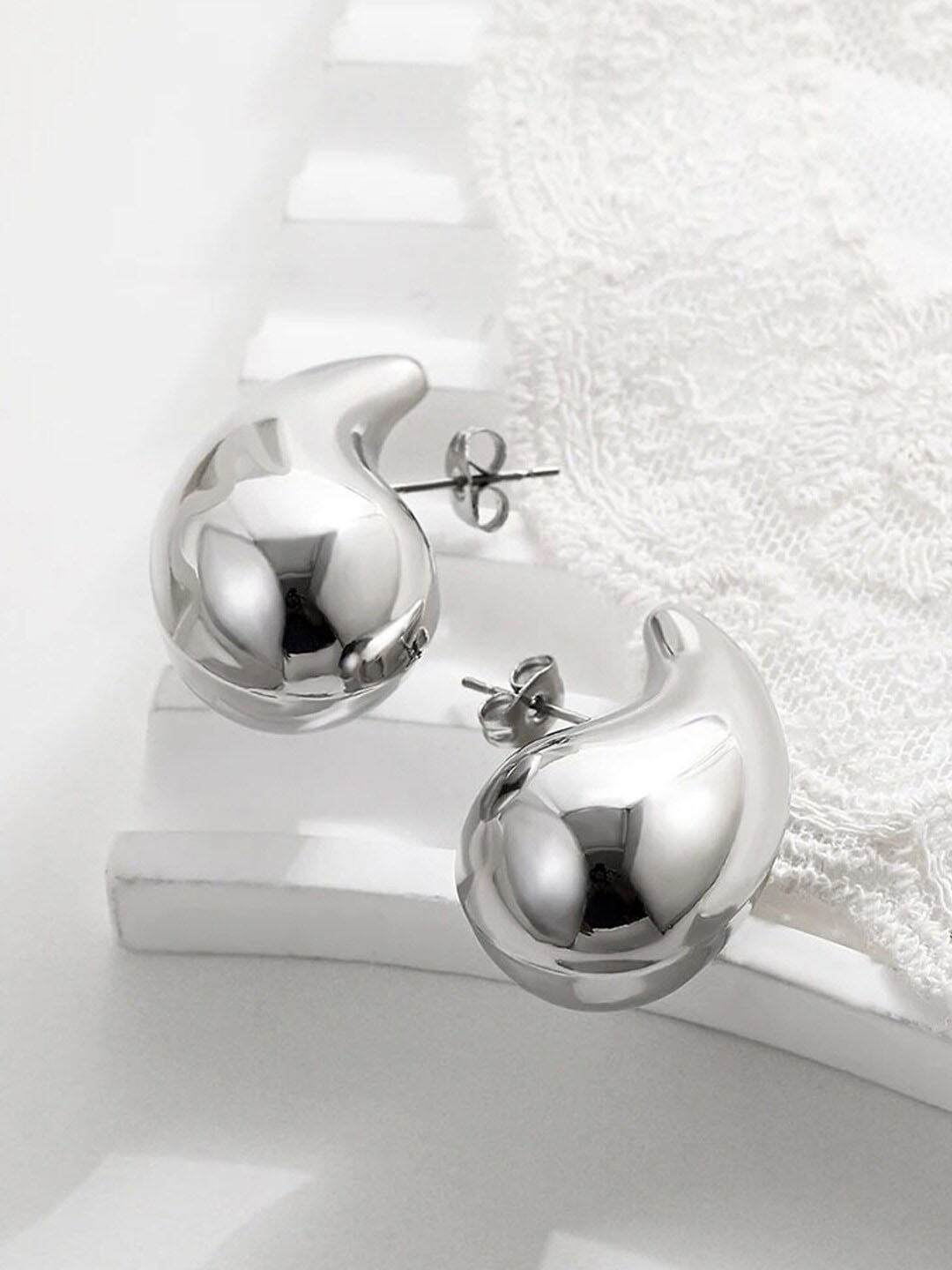

Jewels Galaxy Teardrop Shaped Studs Earrings, Silver