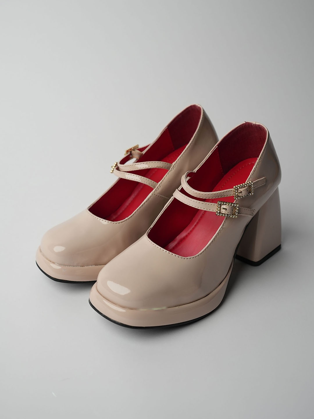 

Theater Buckle Detailed Platform Heeled Pumps, Beige