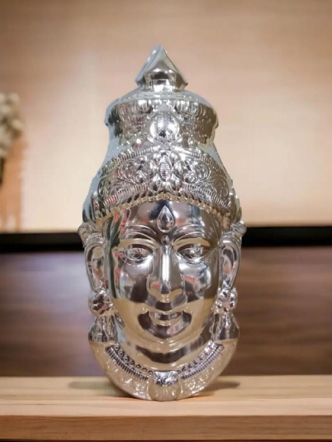 

Sigaram Silver Toned Textured Mahalakshmi Face Mukoot