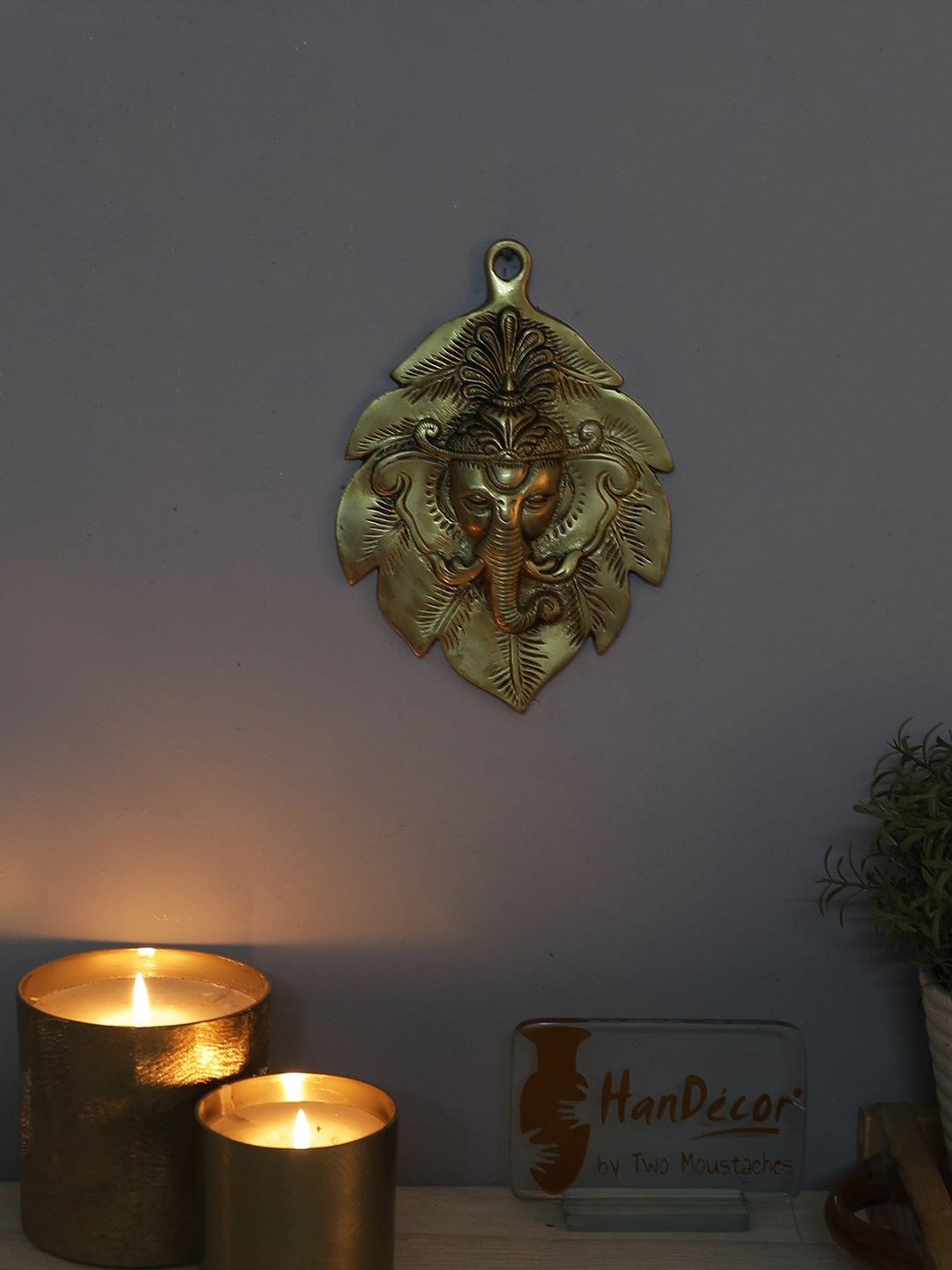

Two Moustaches Ganesha Face On Leaf Wall Hanging, Gold