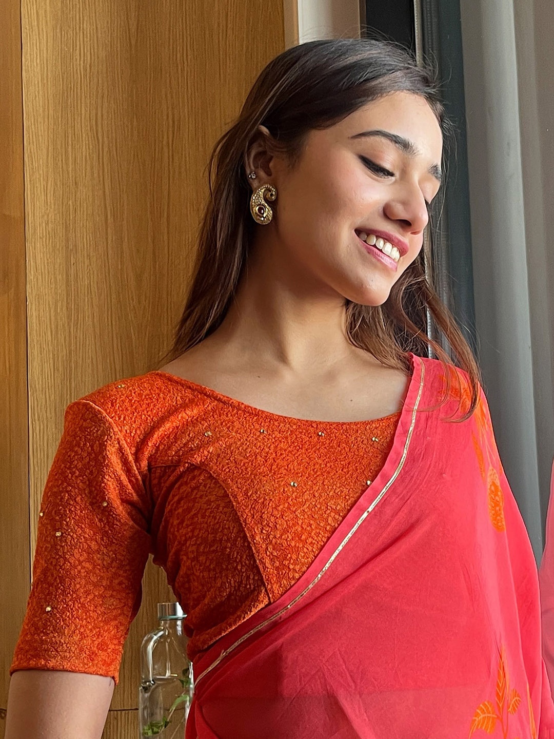 

Bindigasm's Advi Floral Self Design Sequinned Stretchable Saree Blouse, Orange