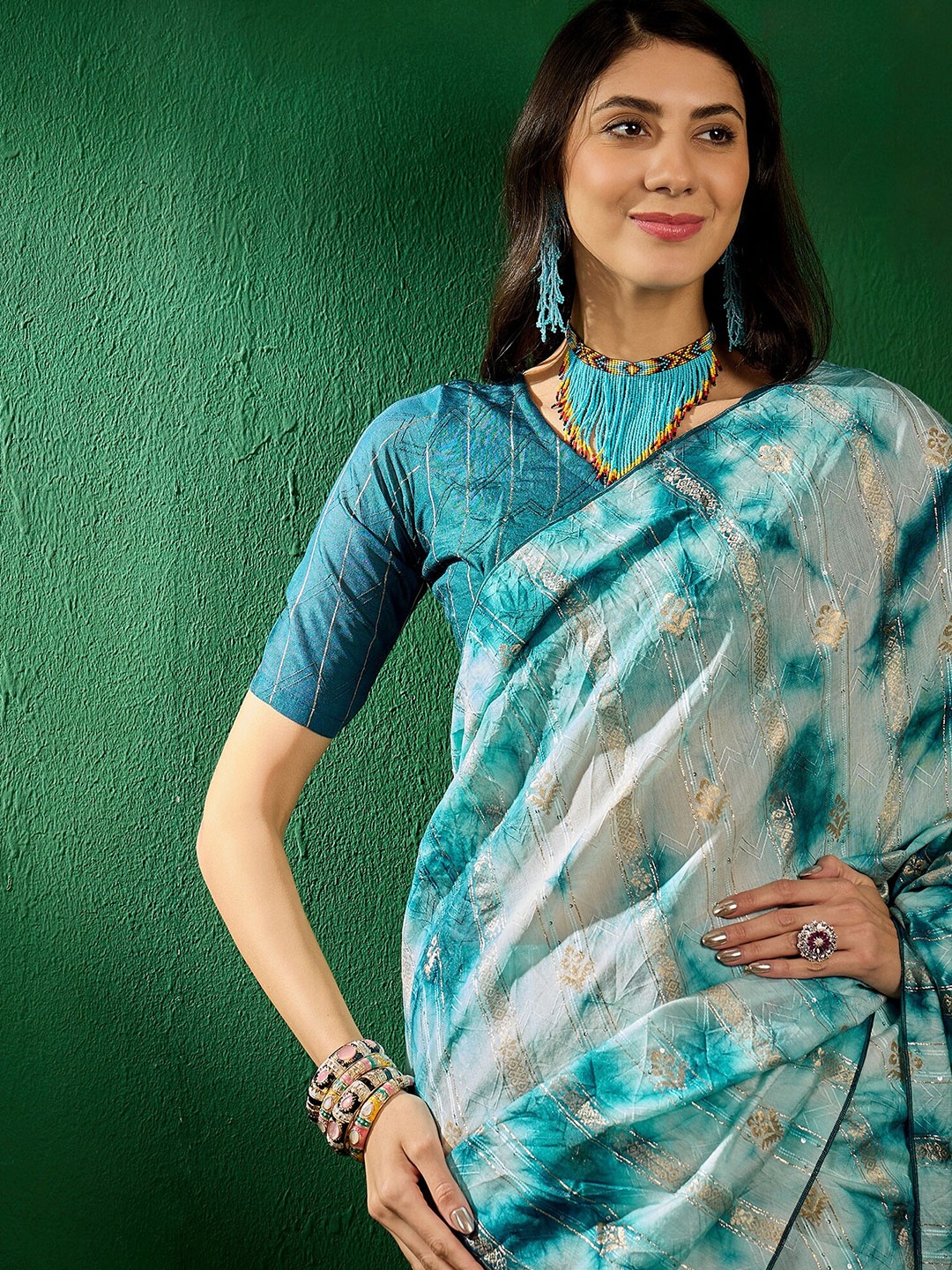 

Sangria Teal Blue Ethnic Motifs Woven Designed Zari Sarees