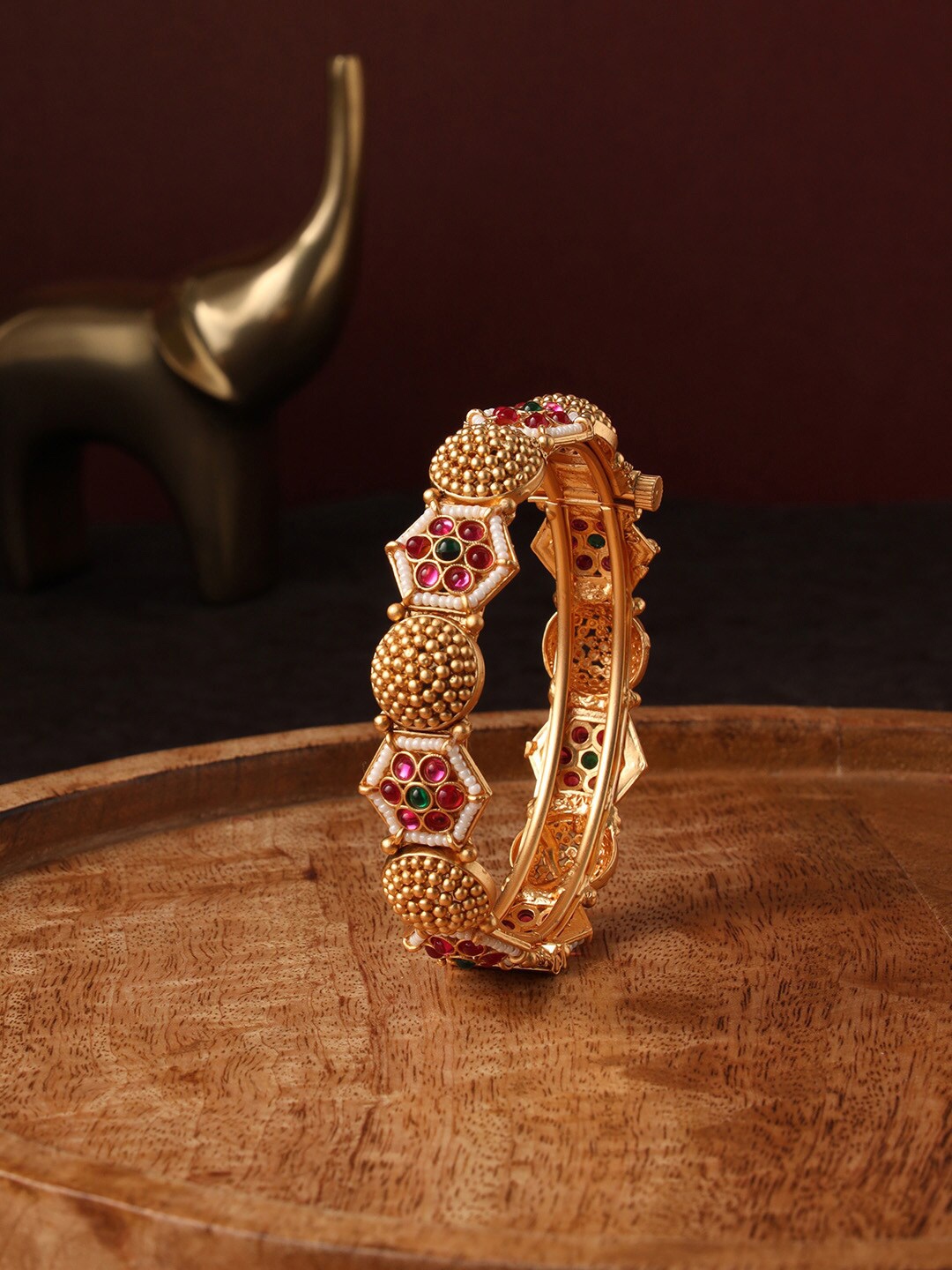 

justpeachy Temple Gold Plated Bangle Style Bracelet