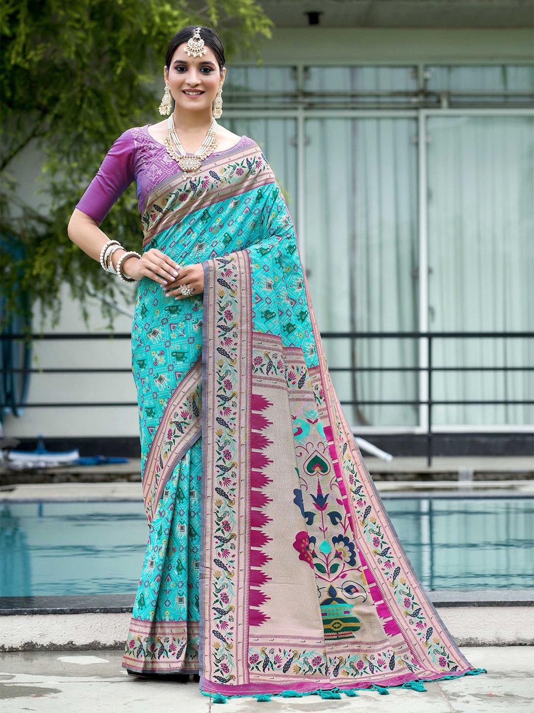 

Mitera Blue Ethnic Motifs Woven Design Zari Silk Blend Patola Saree