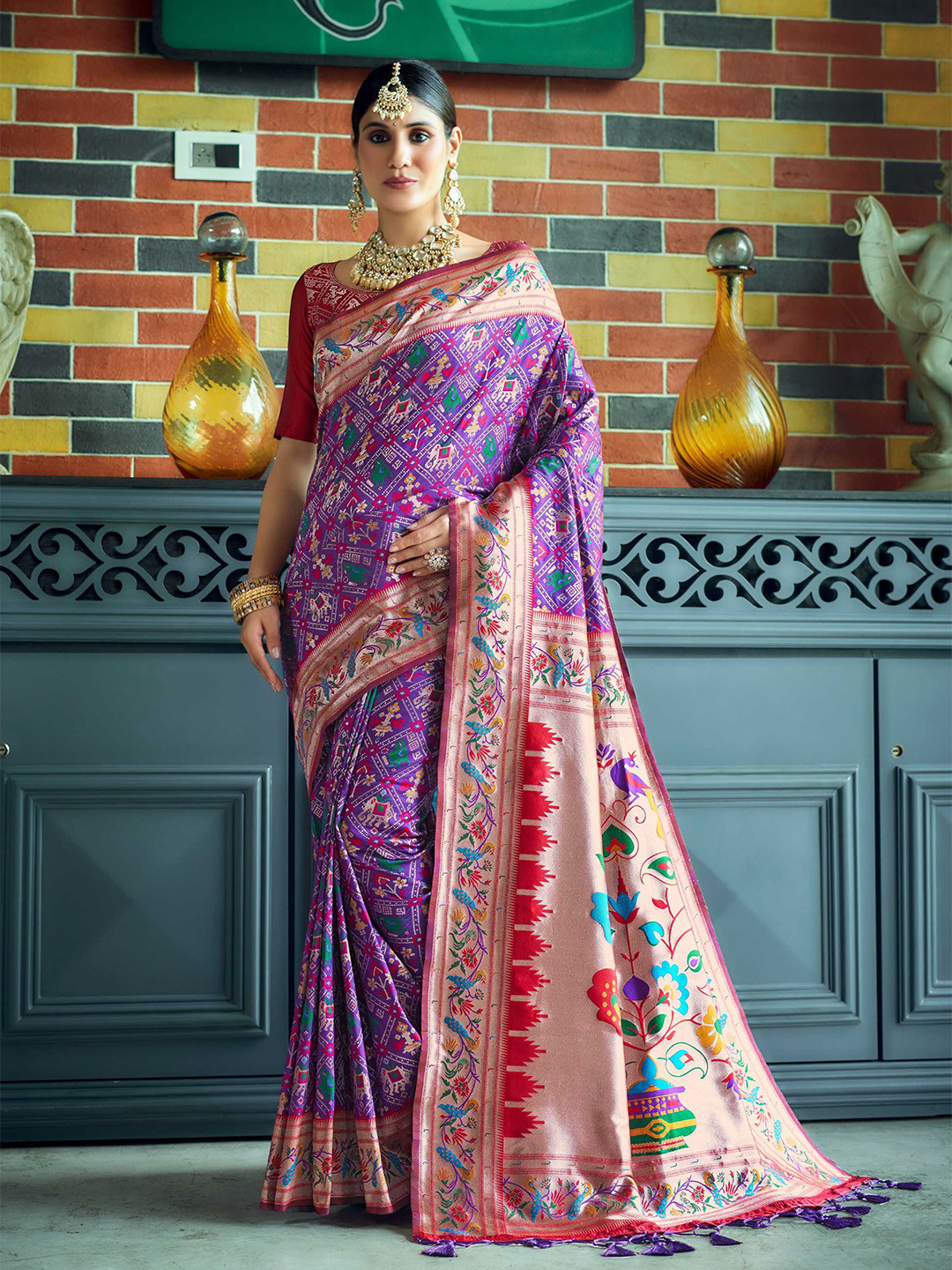 

Mitera Purple Ethnic Motifs Woven Design Zari Patola Saree