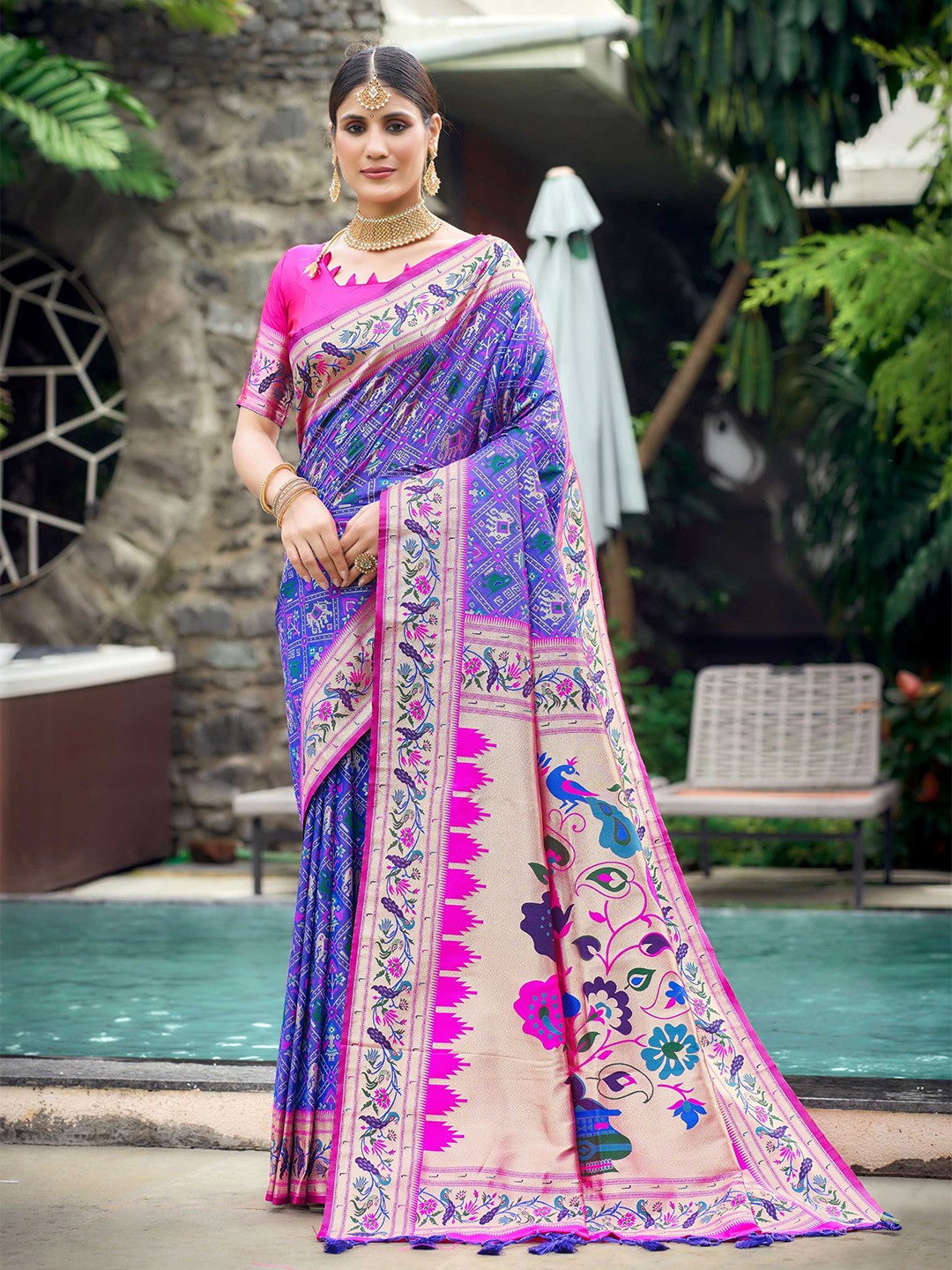 

Mitera Blue Ethnic Motifs Woven Design Zari Patola Saree