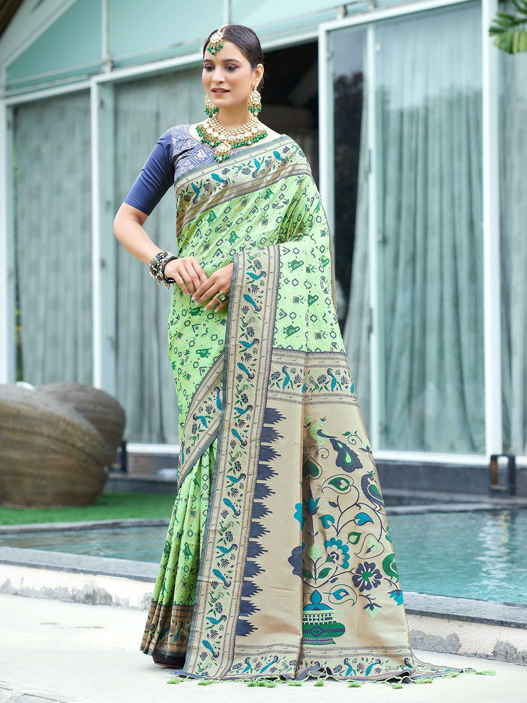 

Mitera Green Ethnic Motifs Woven Design Zari Patola Saree