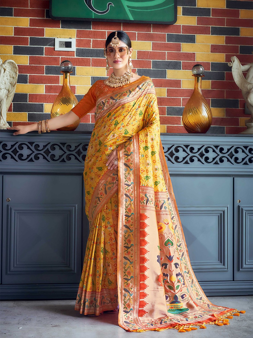 

Mitera Yellow Ethnic Motifs Woven Design Zari Silk Blend Patola Saree